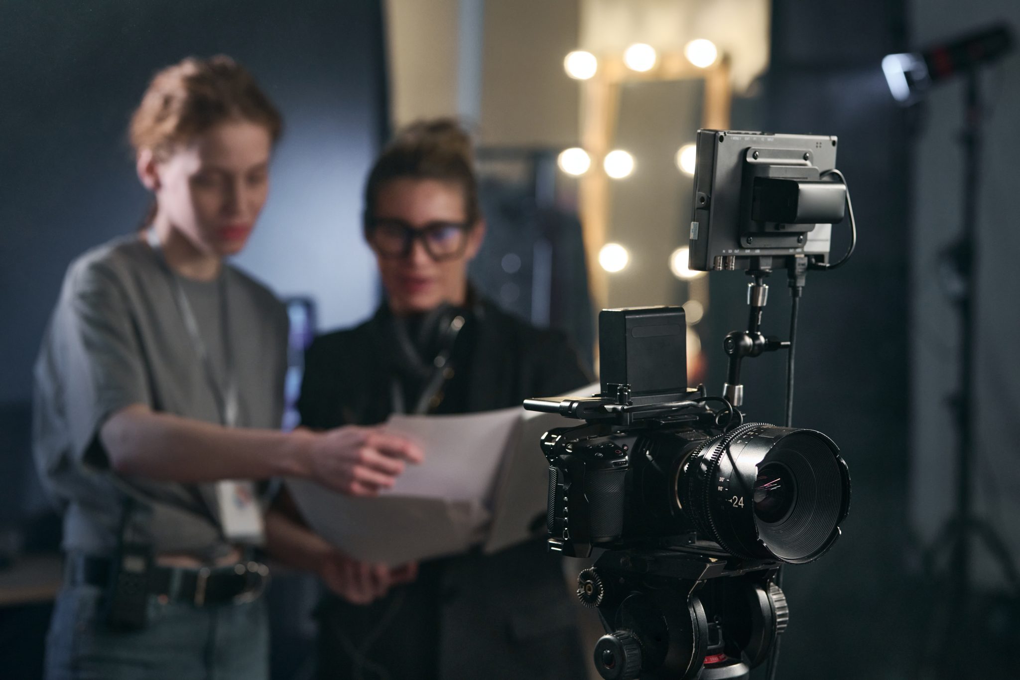 Production crew working around a cinema camera